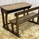 Early 20th-century oak school desk with porcelain inkwells