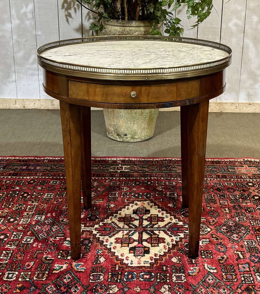 Louis XVI style bouillotte table in mahogany with a white marble top.