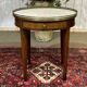 Louis XVI style bouillotte table in mahogany with a white marble top.