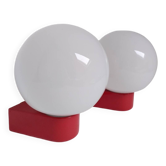 2 postmodern opaline and red metal wall lights, 1980