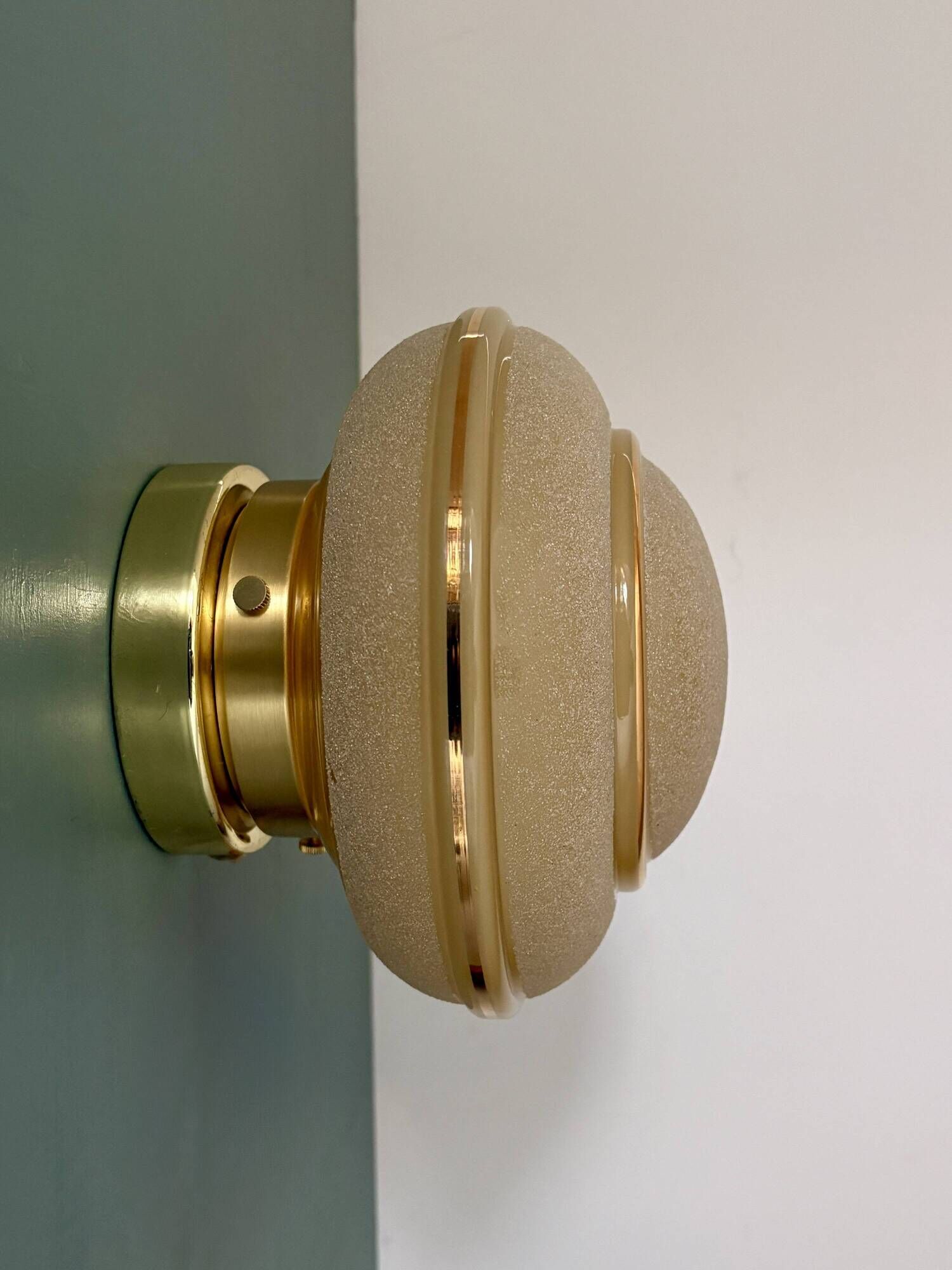 Vintage Art Deco globe wall/ceiling light in frosted yellow and gold glass.