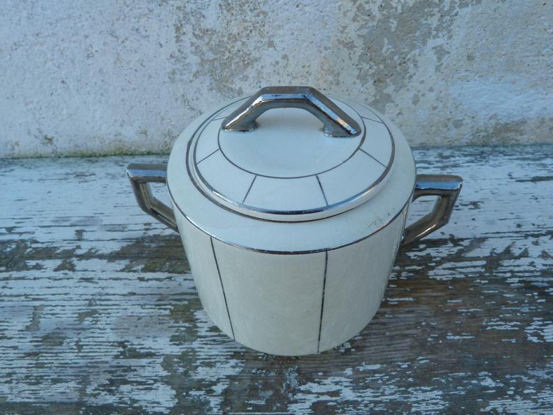 Off-white sugar and silver Art Deco Wolves Mill
