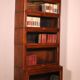 Library says stacking bookcase in oak with 6 elements and a projection.