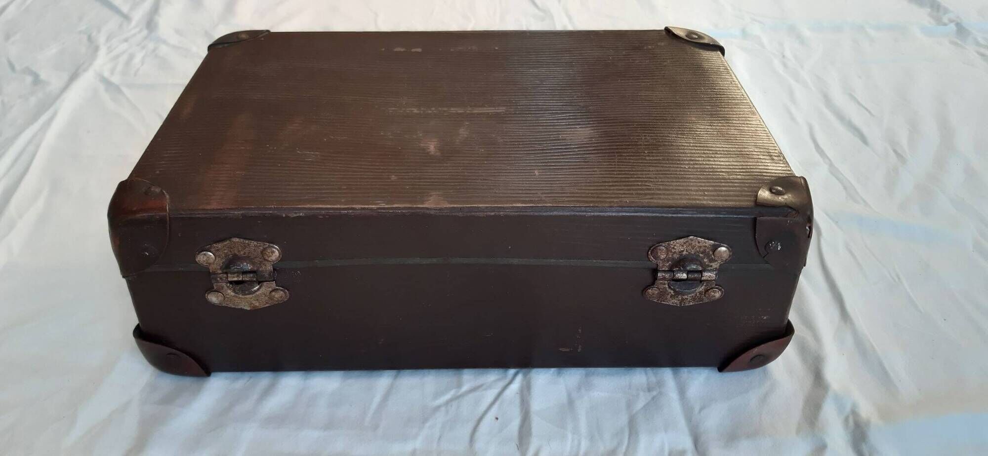 Small old suitcase with a ribbed appearance