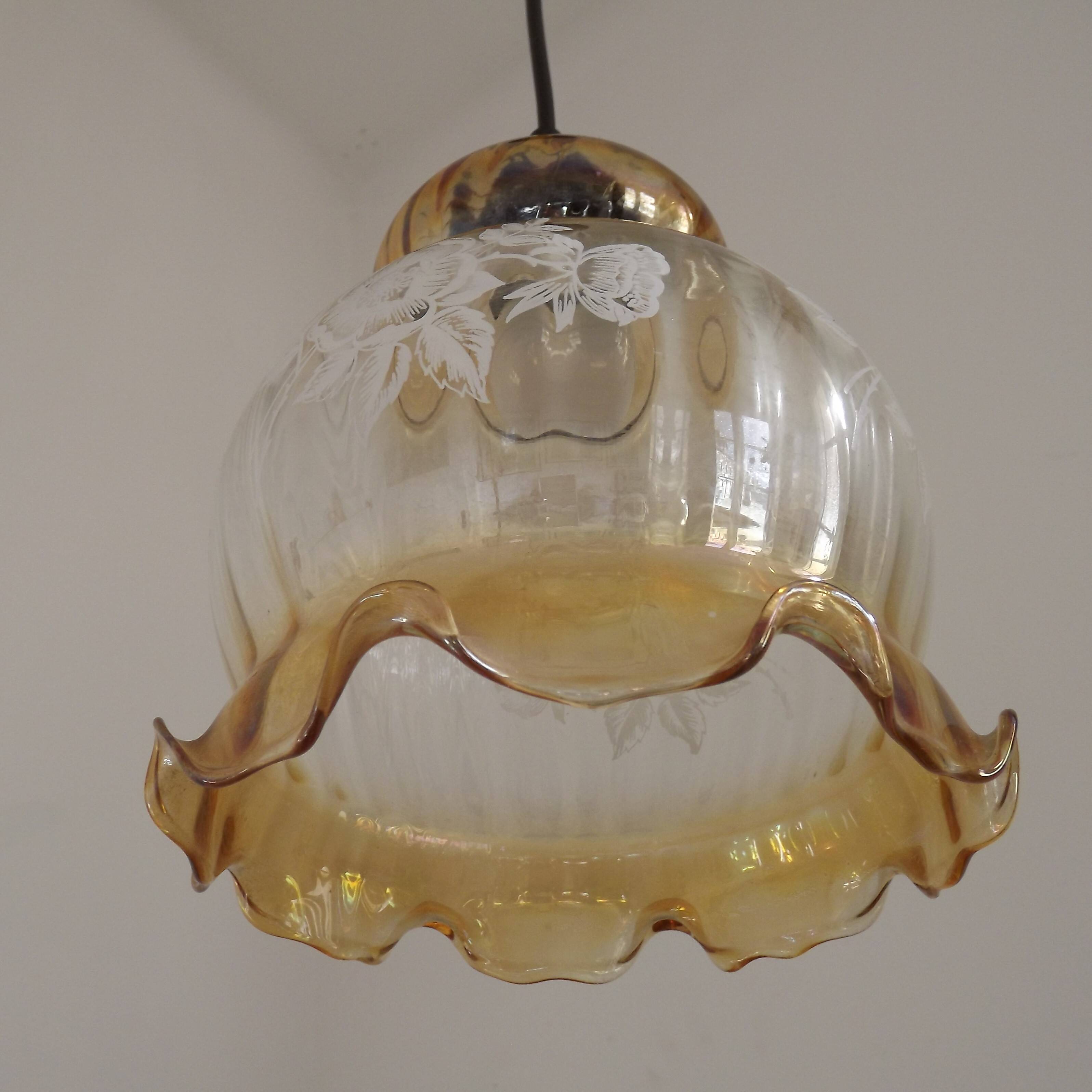 French vintage amber and clear glass ceiling light with white floral decoration.