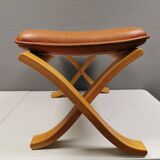 Folding Stool, in light beech wood with cognac colored leather cushion.