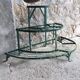 Antique half-moon metal plant stand