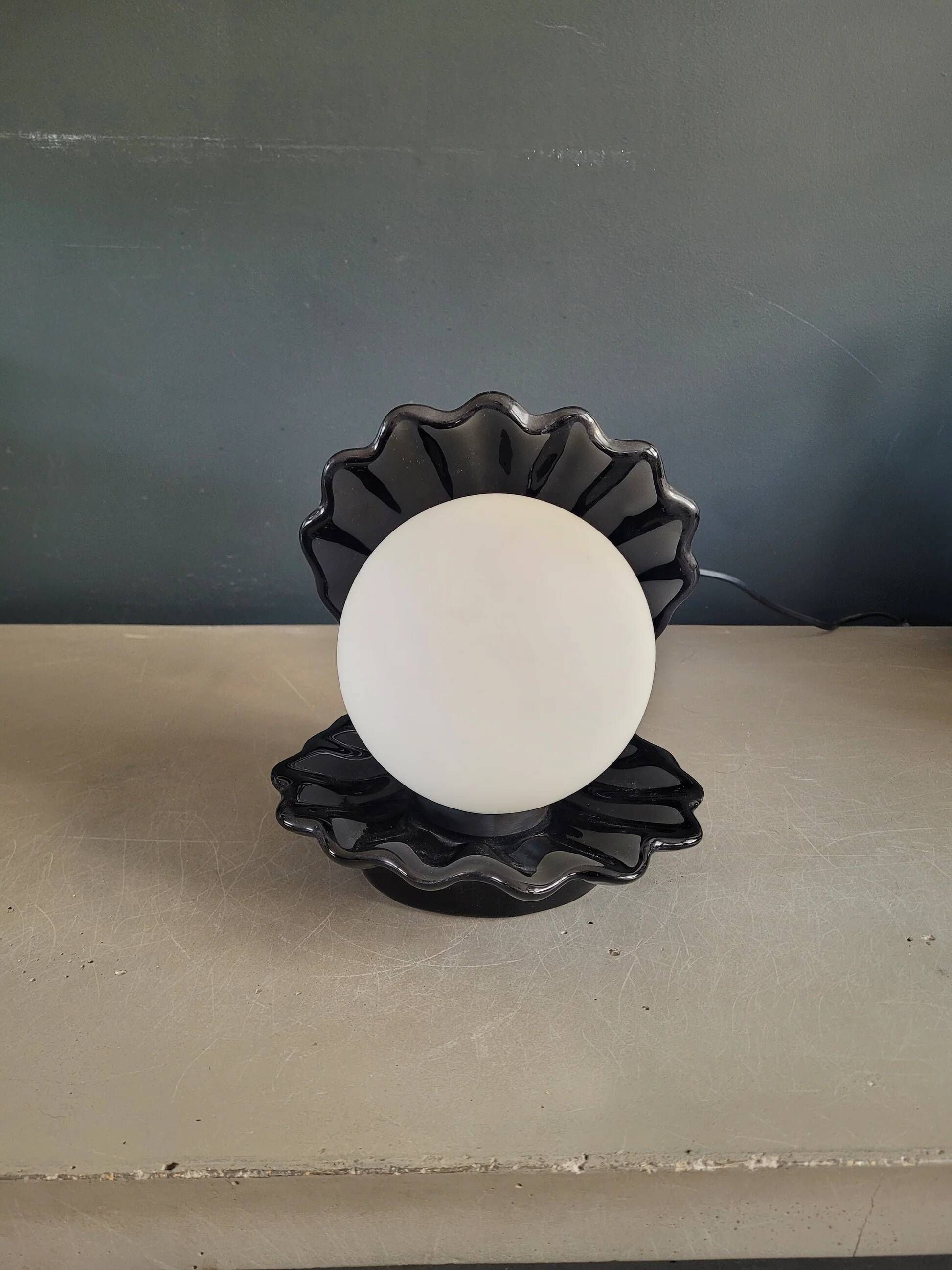 Vintage shell lamp in black porcelain with opaline globe.