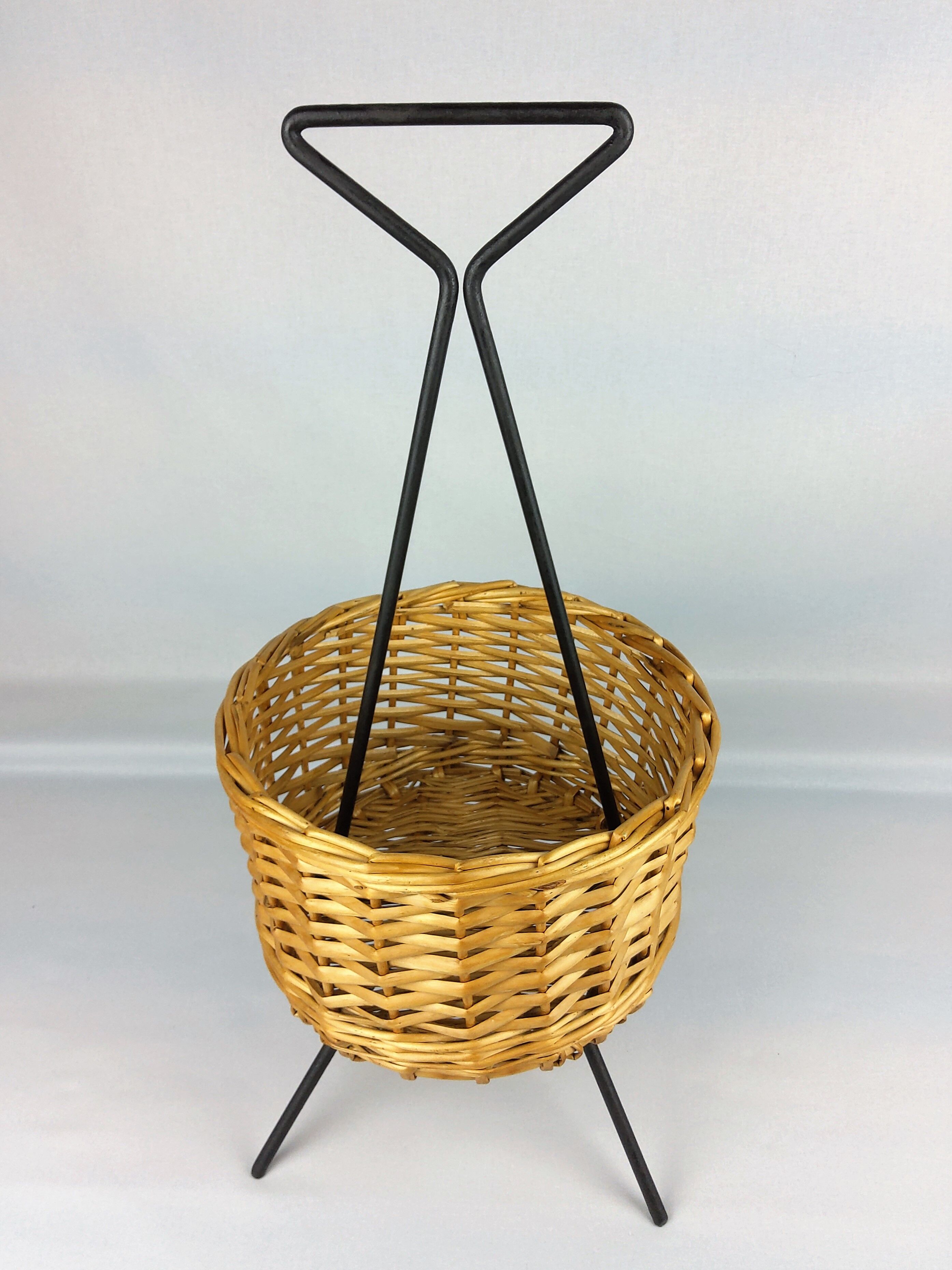 Black metal rattan trash can on 1960