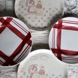 Vintage mismatched earthenware dessert plates with red patterns