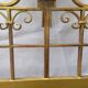 Golden wrought iron bedhead