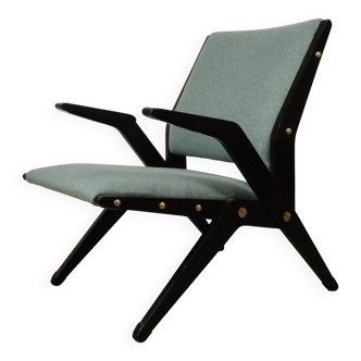 Vintage armchair from the 1960s in black wood and fabric.