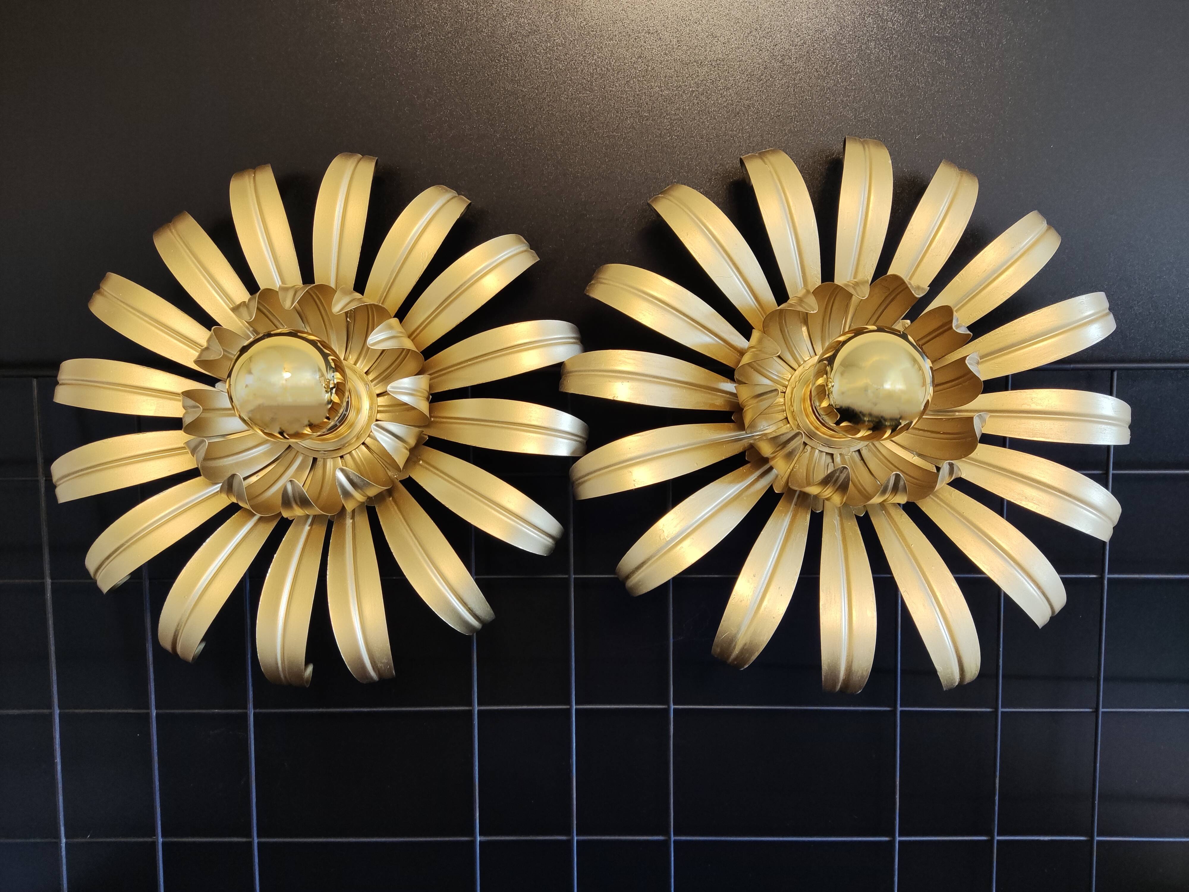Golden metal flower sconces