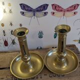 Bougeoirs à poussoirs en laiton doré