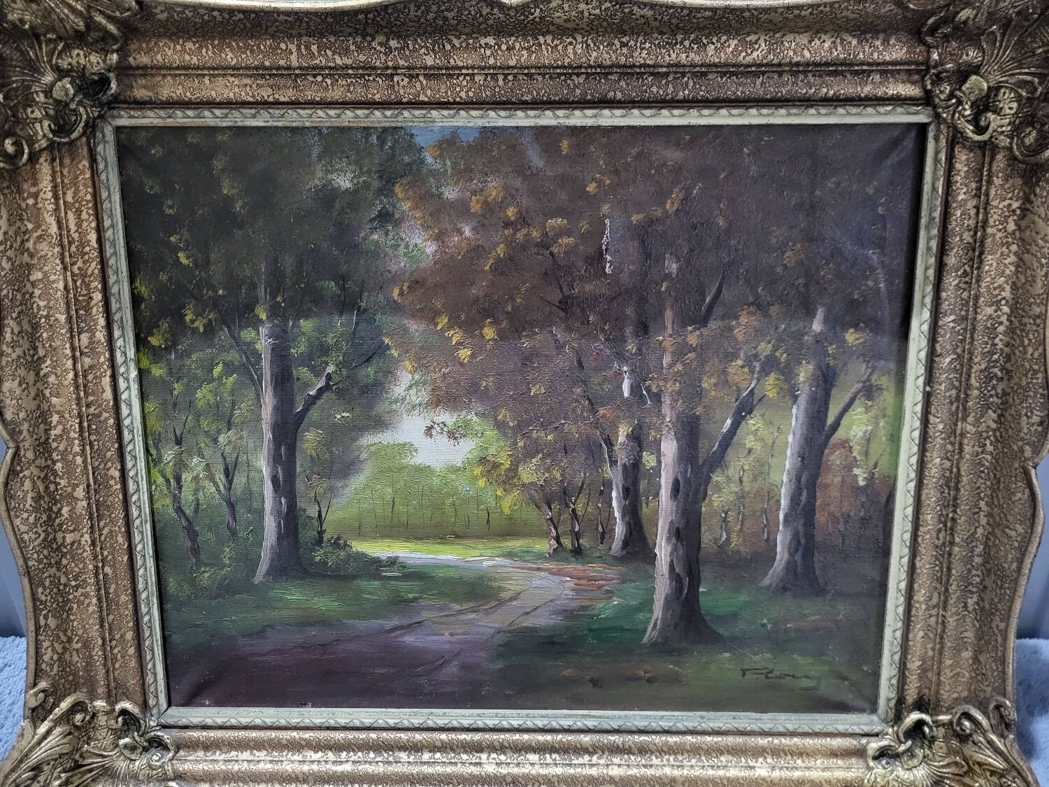 Signed oil painting on gilded wooden frame