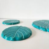 Ceramic trivet and bottle coaster from the 1950s.