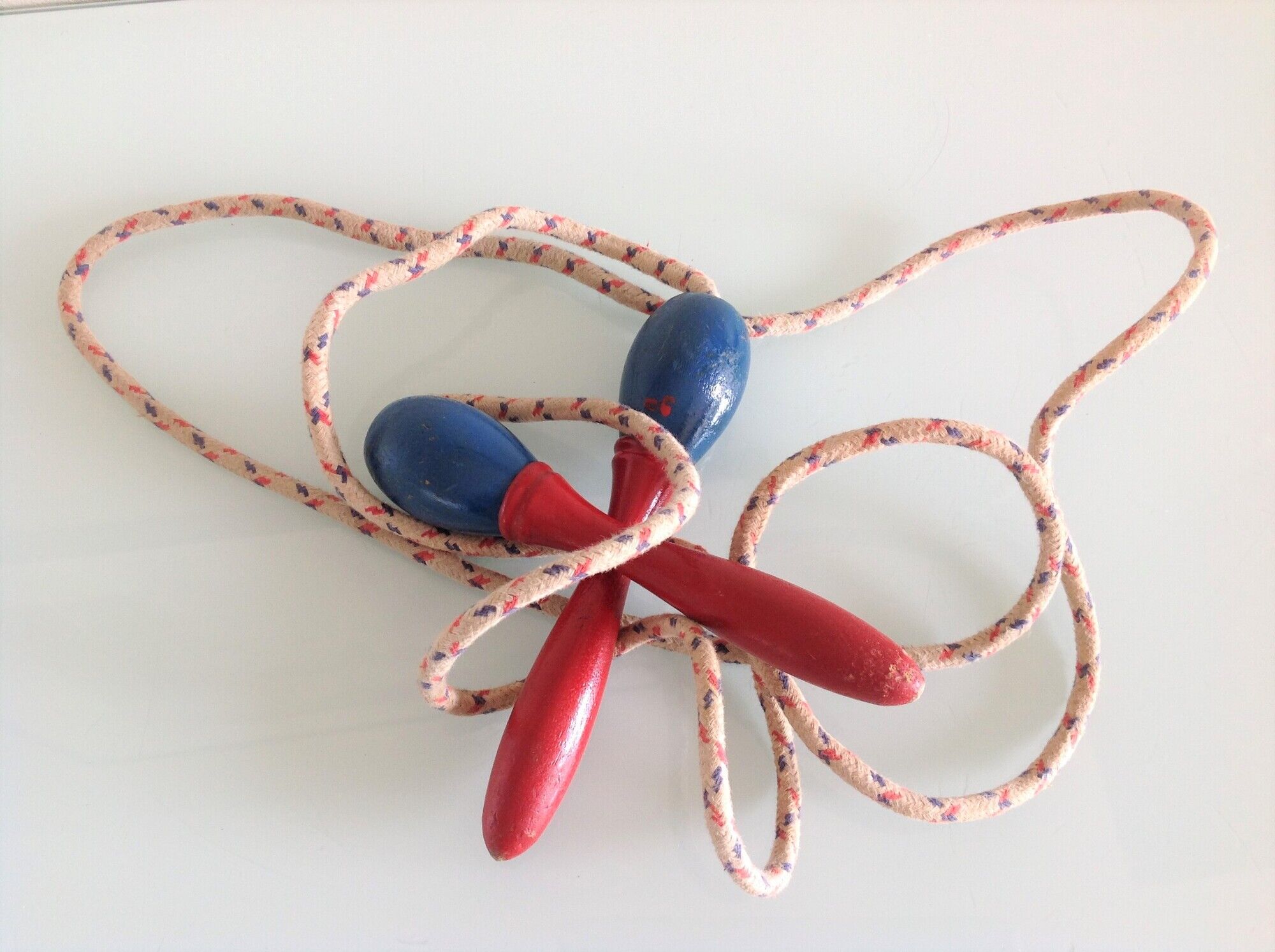 Old wooden jump rope red and blue / vintage
