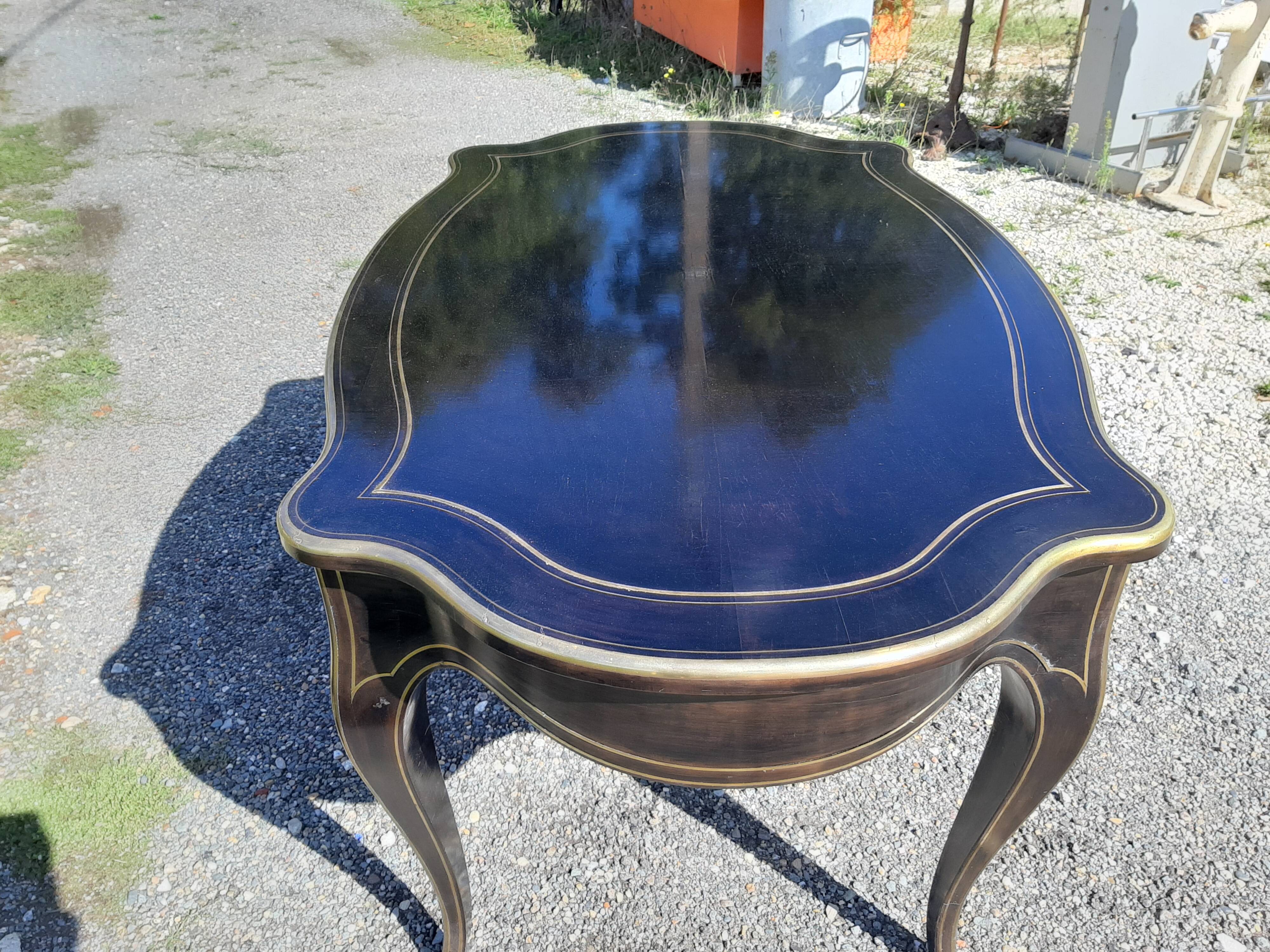 Napoleon III black lacquered wood and brass table