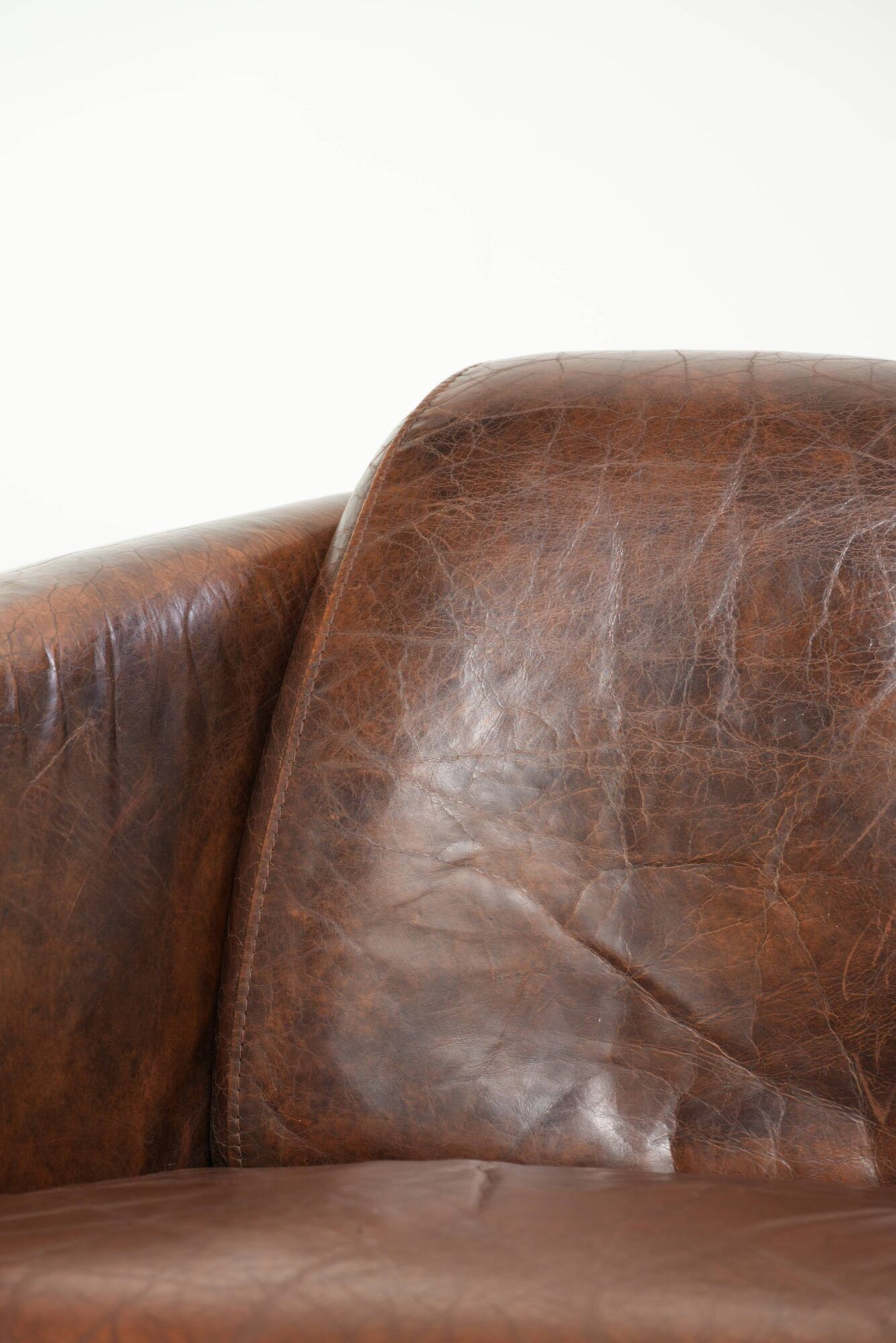 Cowhide armchair in Aviator design in a warm brown colour
