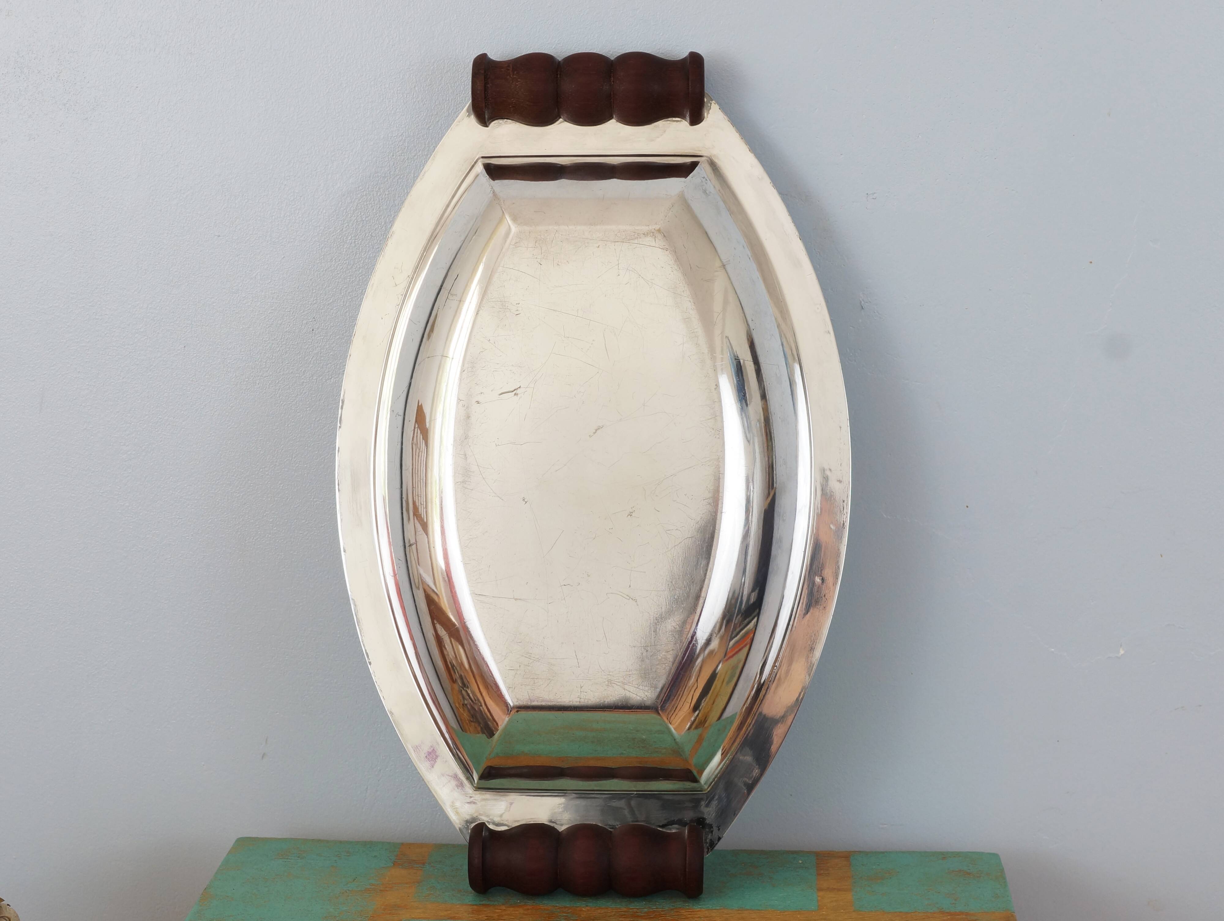 Silver plated metal hollow dish and mahogany handles