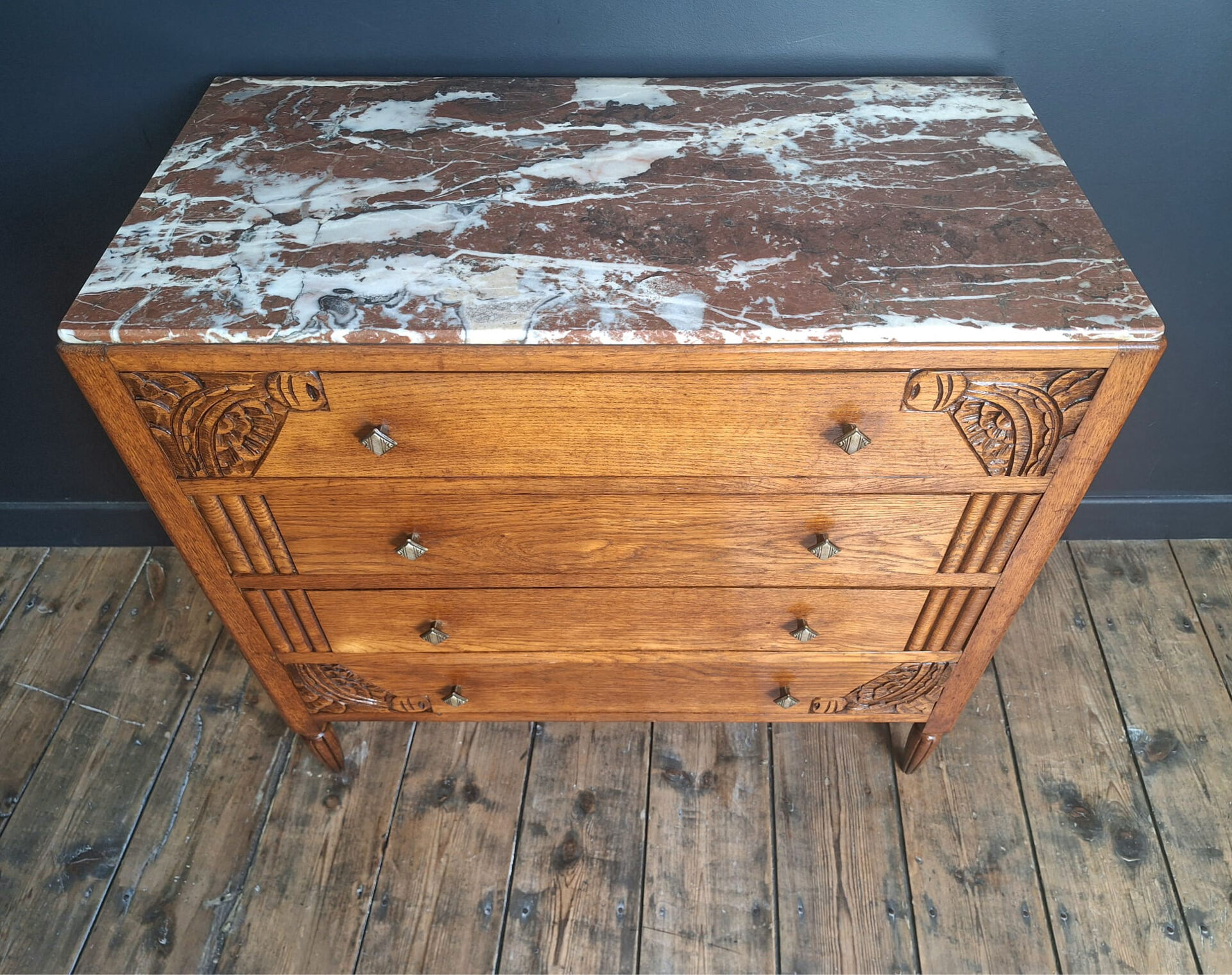 Art Deco commode with marble top, vintage antique furniture.