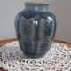 Decorative vase in blue glazed ceramic with floral decoration and arabesques, circa 1930