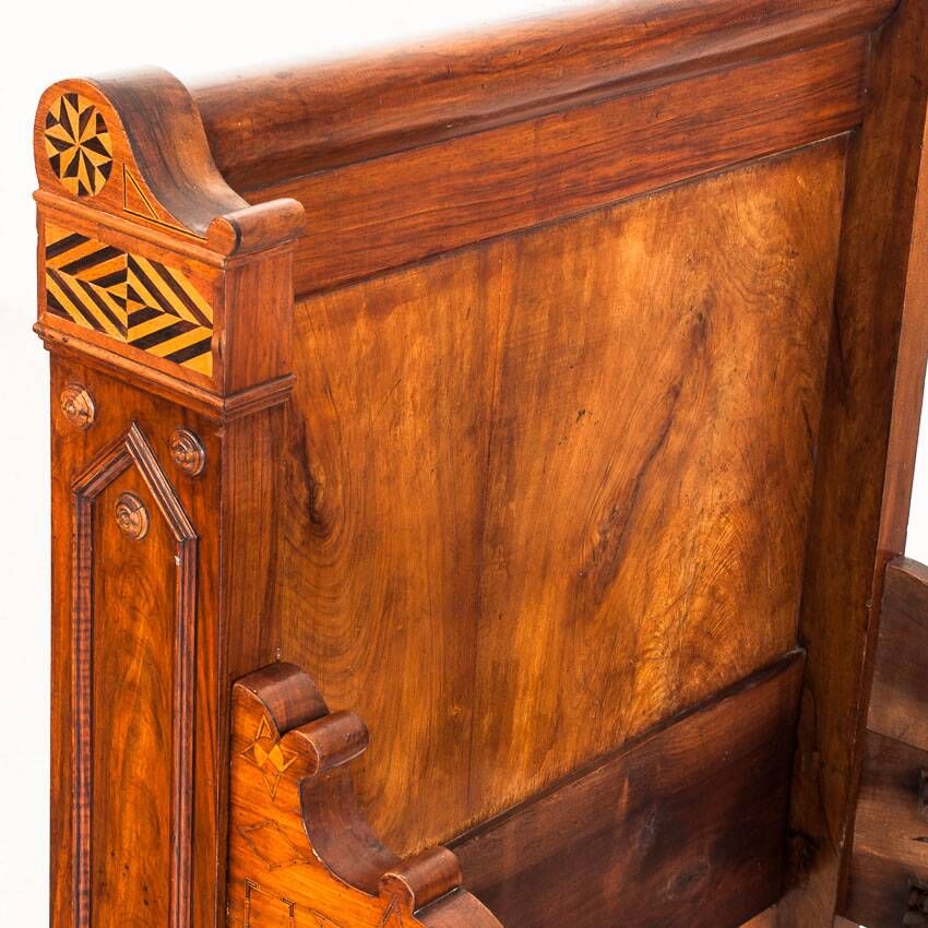 Bed made of solid walnut with marquetry details. France, 1930s.