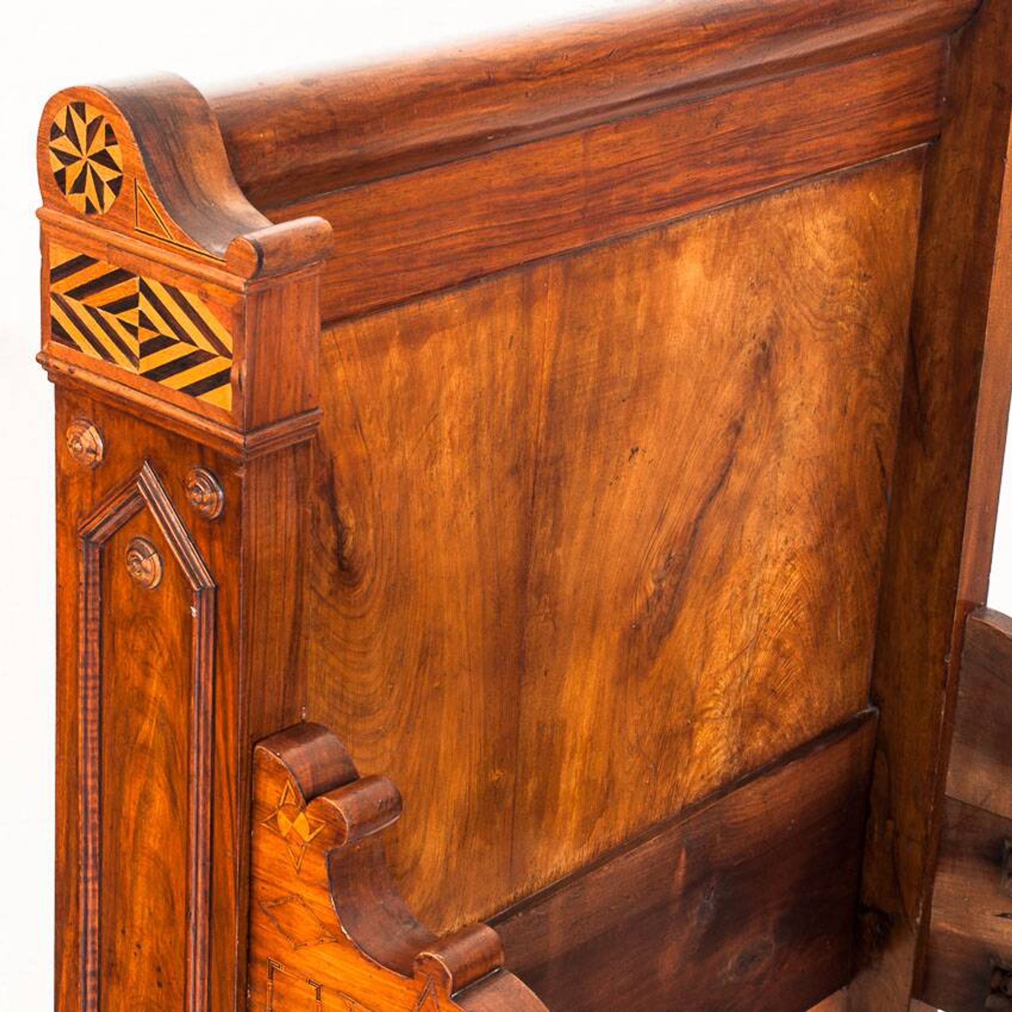 Bed made of solid walnut with marquetry details. France, 1930s.