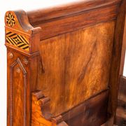 Bed made of solid walnut with marquetry details. France, 1930s.