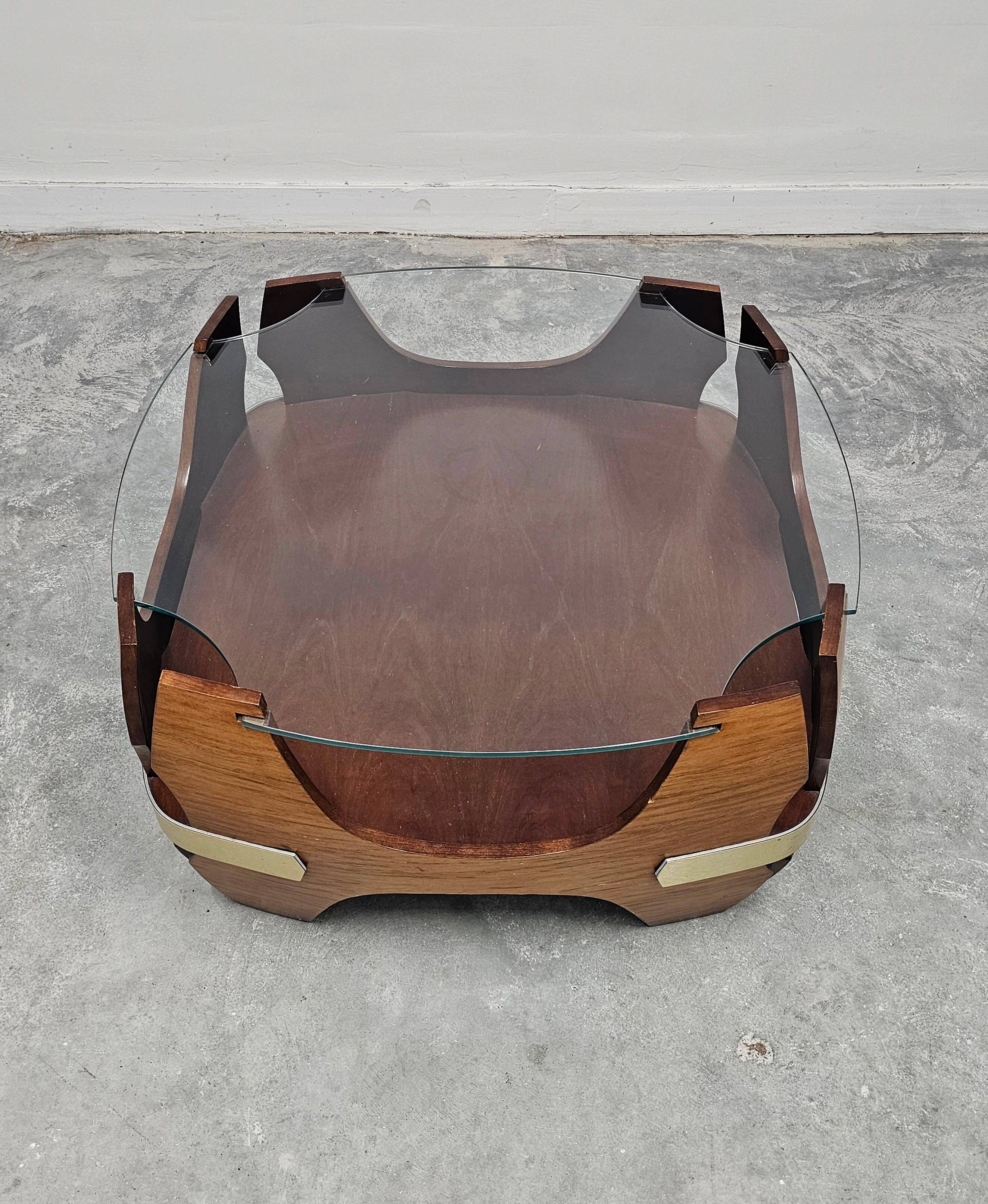 Mid-century coffee table in curved plywood with a glass top, 1940s.