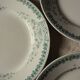 A set of 5 mismatched green blue Terre de fer flat plates