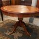 Circular table in light mahogany and leather base claw English style
