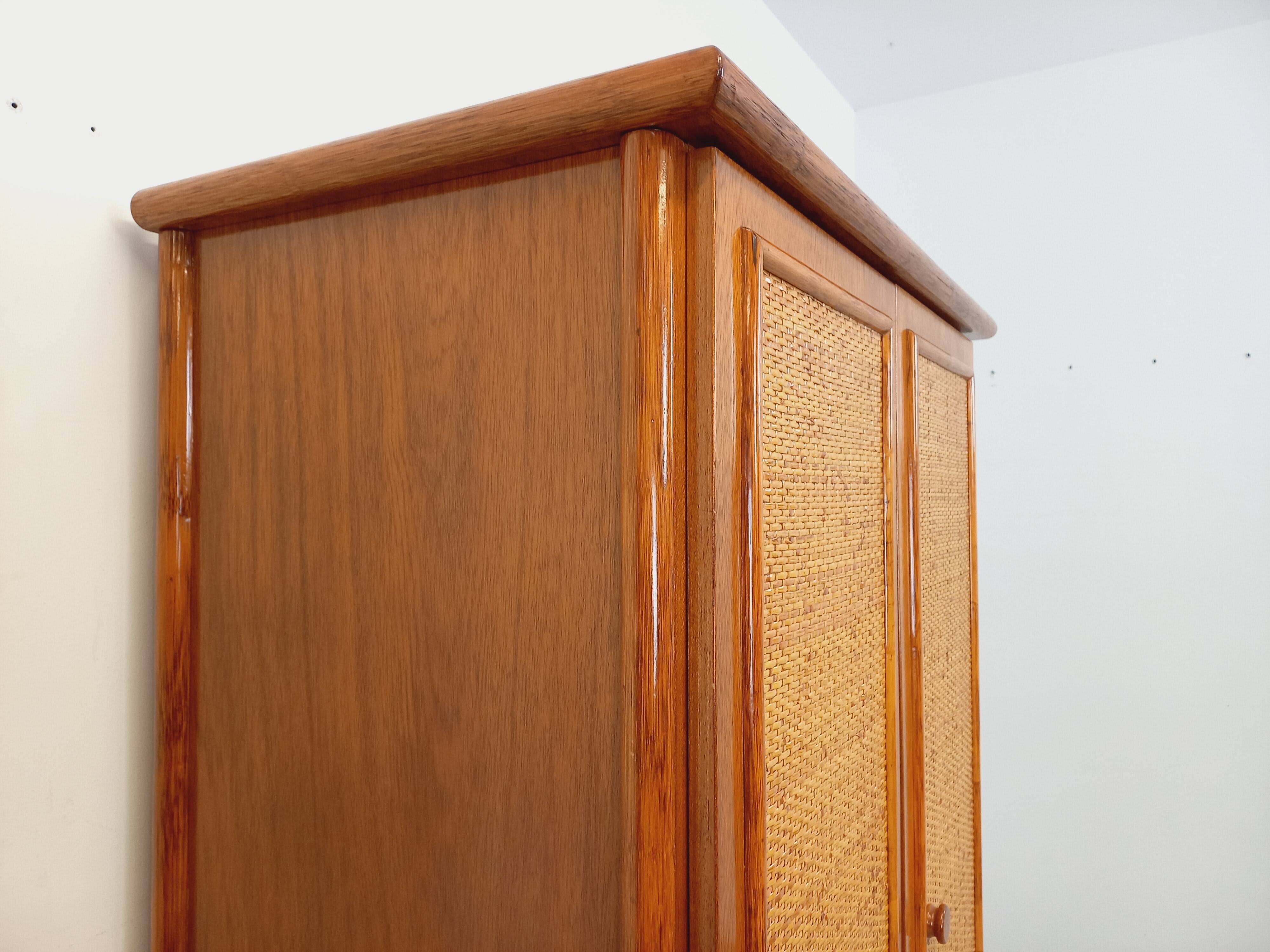 Vintage woven rattan and wood armoire by Maugrion for Roche-Bobois.