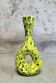Yellow ceramic vase with green highlights