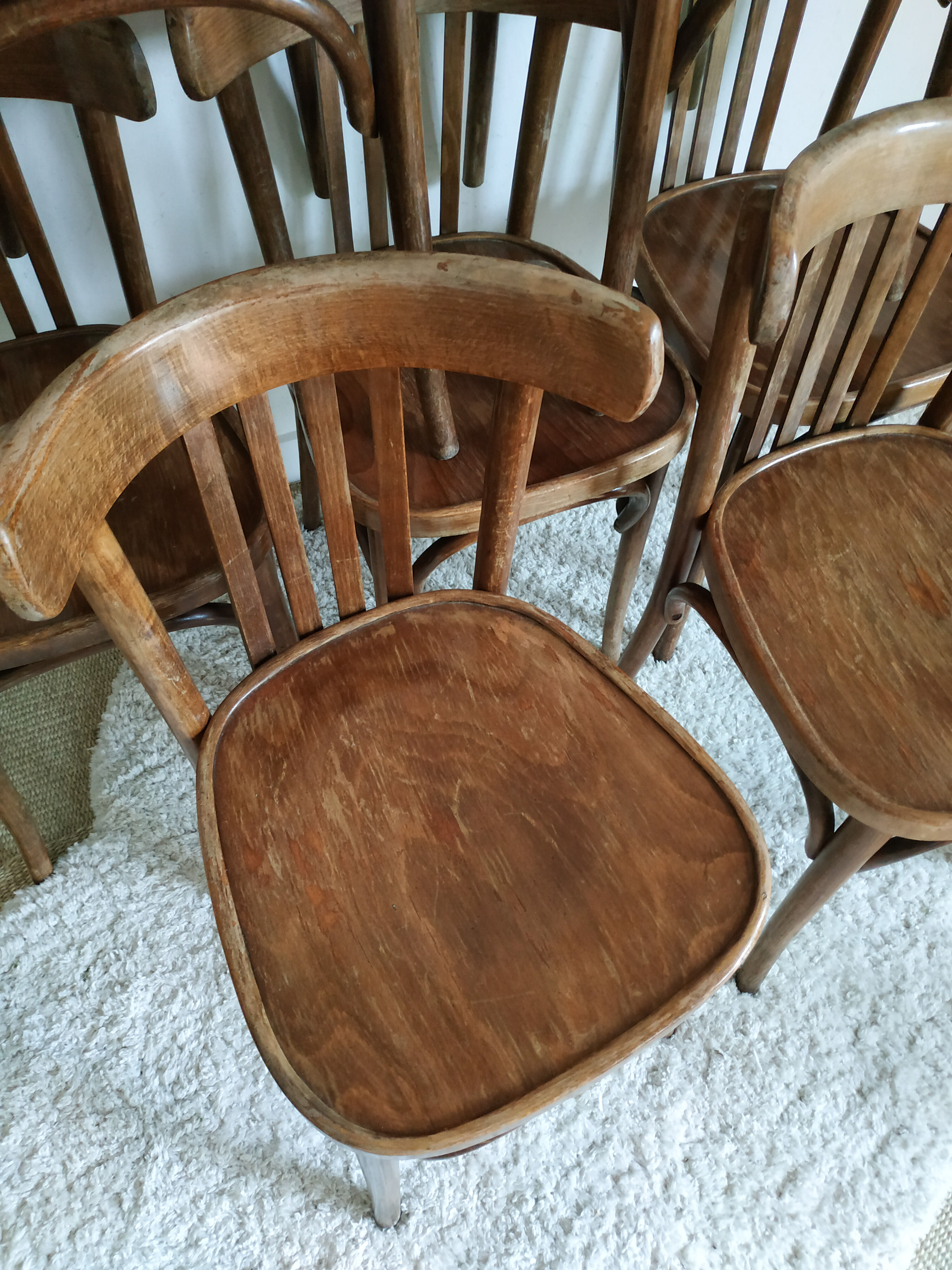 Lot of 7 patinated bistro chairs