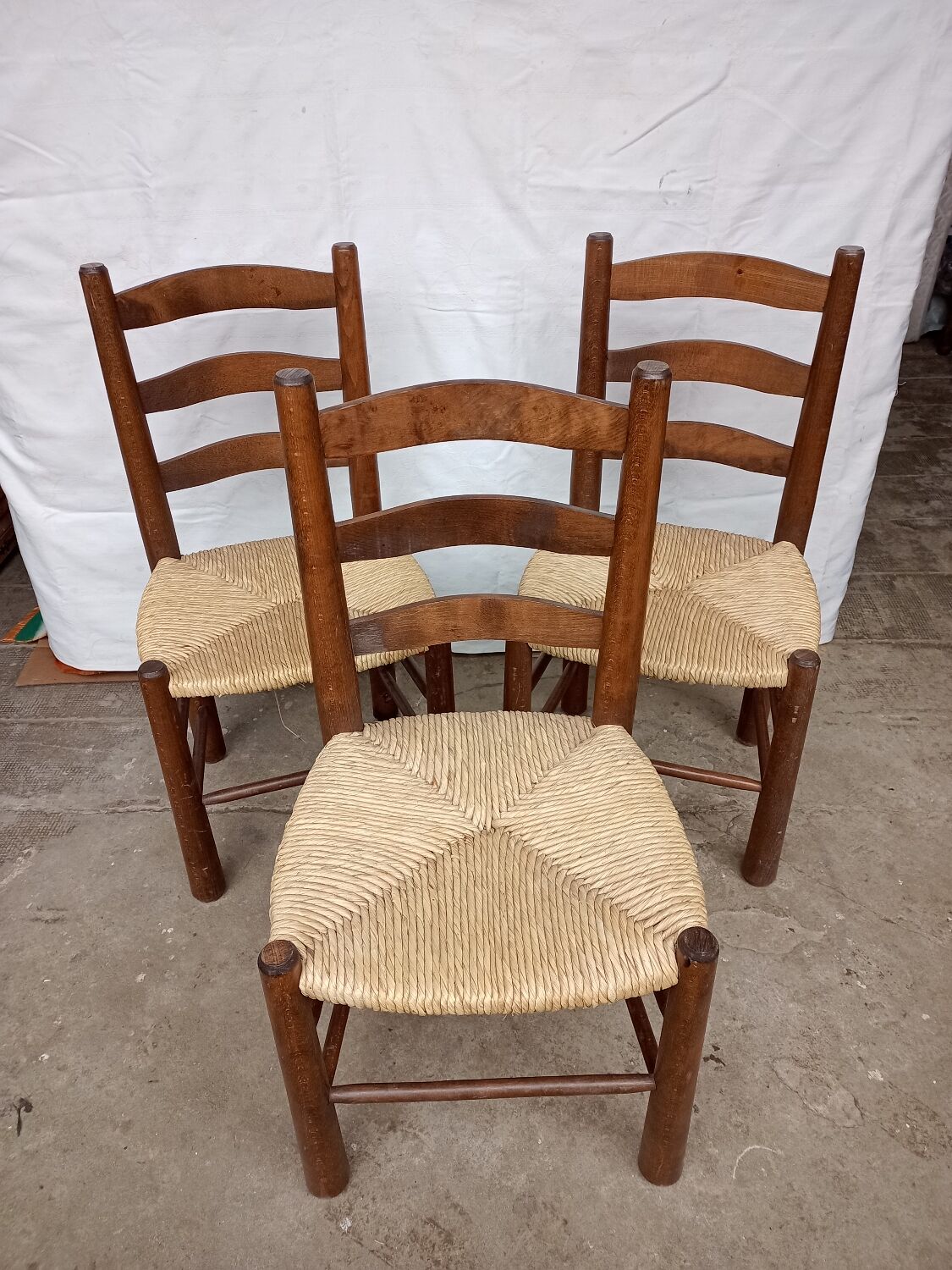 Brutalist chairs in walnut and straw