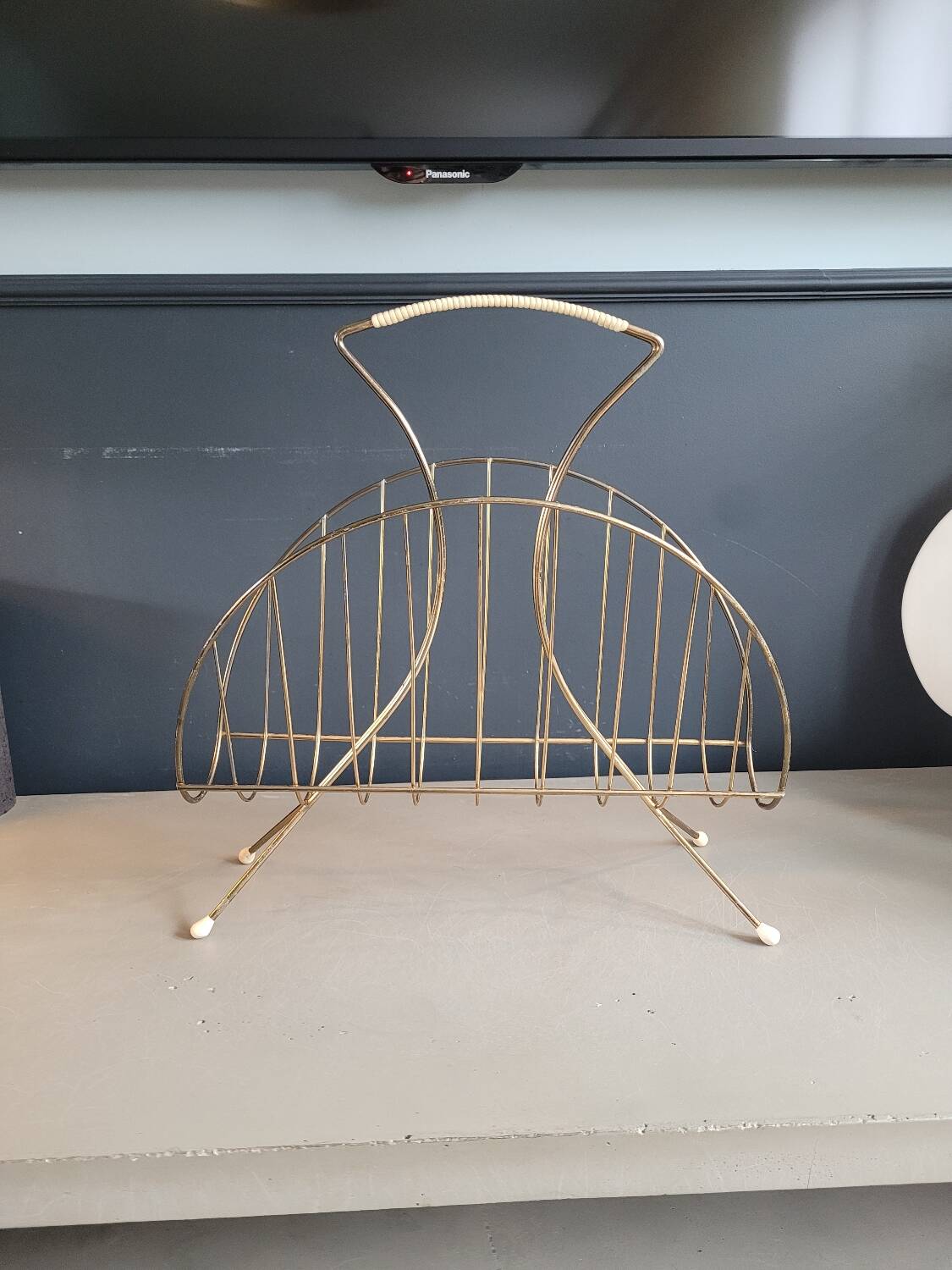 Vintage gold metal magazine rack