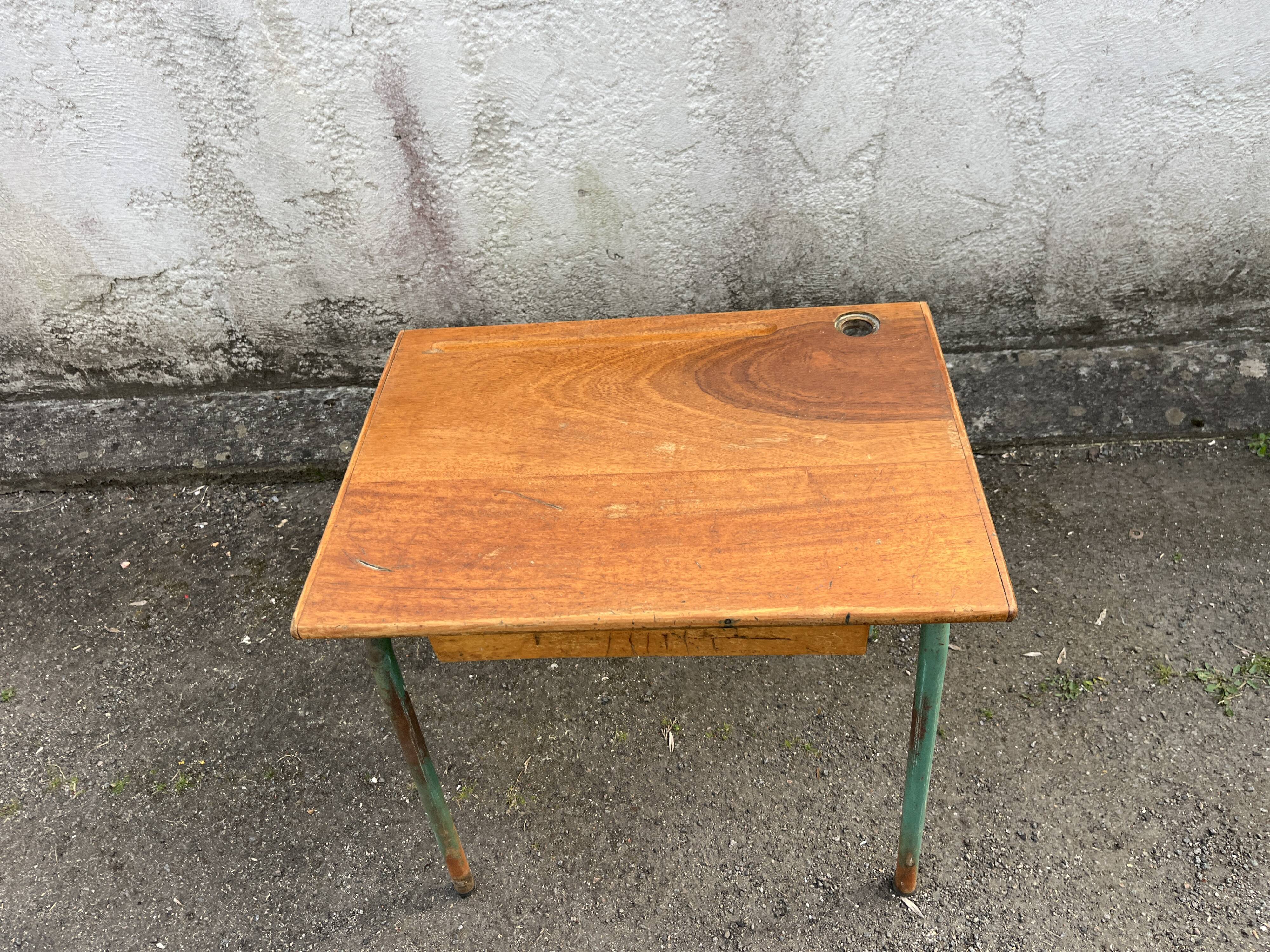 Vintage school desk made of wood and green metal - inkwell hole - antique.