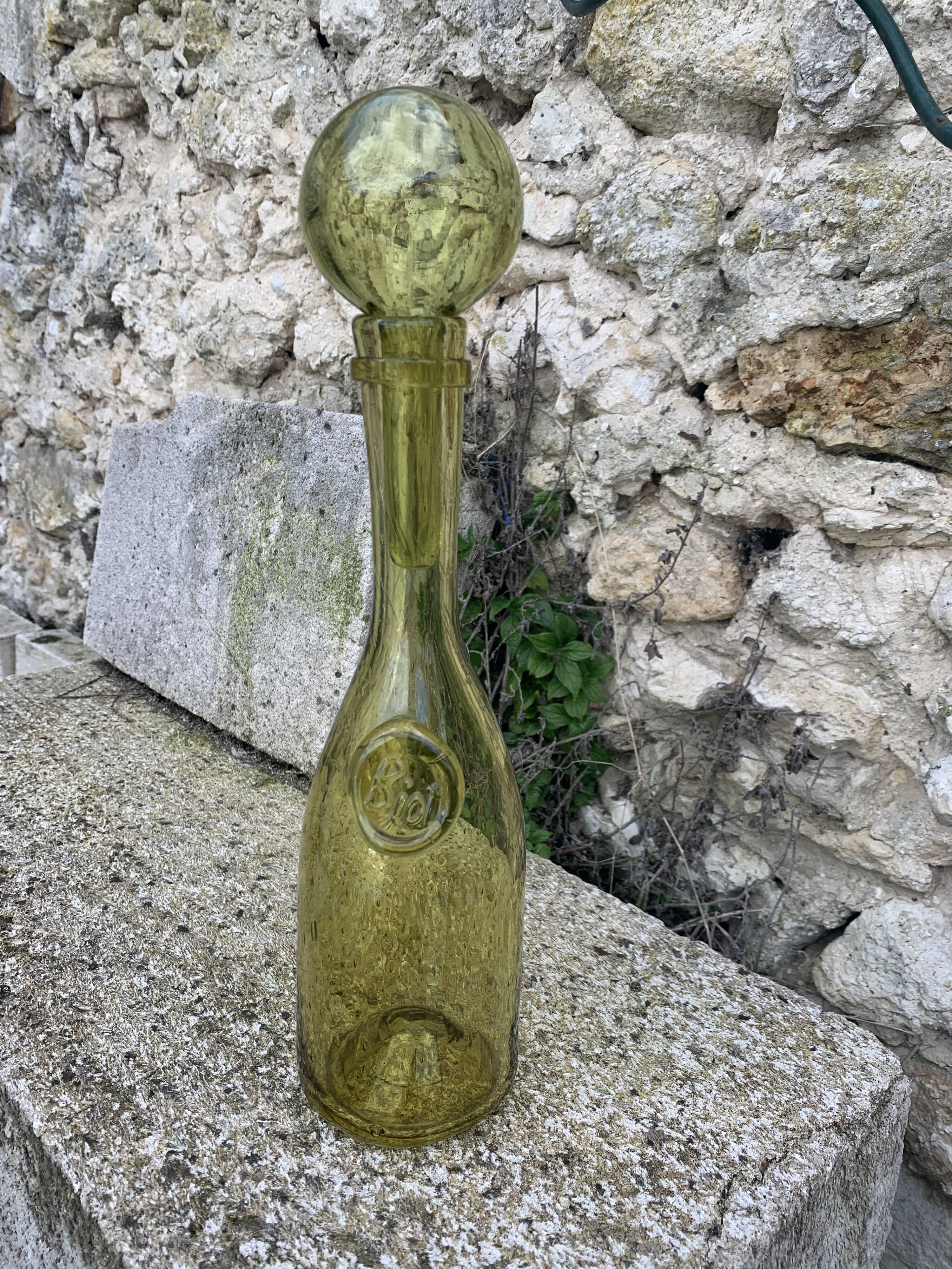 Glassblown glass decanter from the Biot collector glassworks
