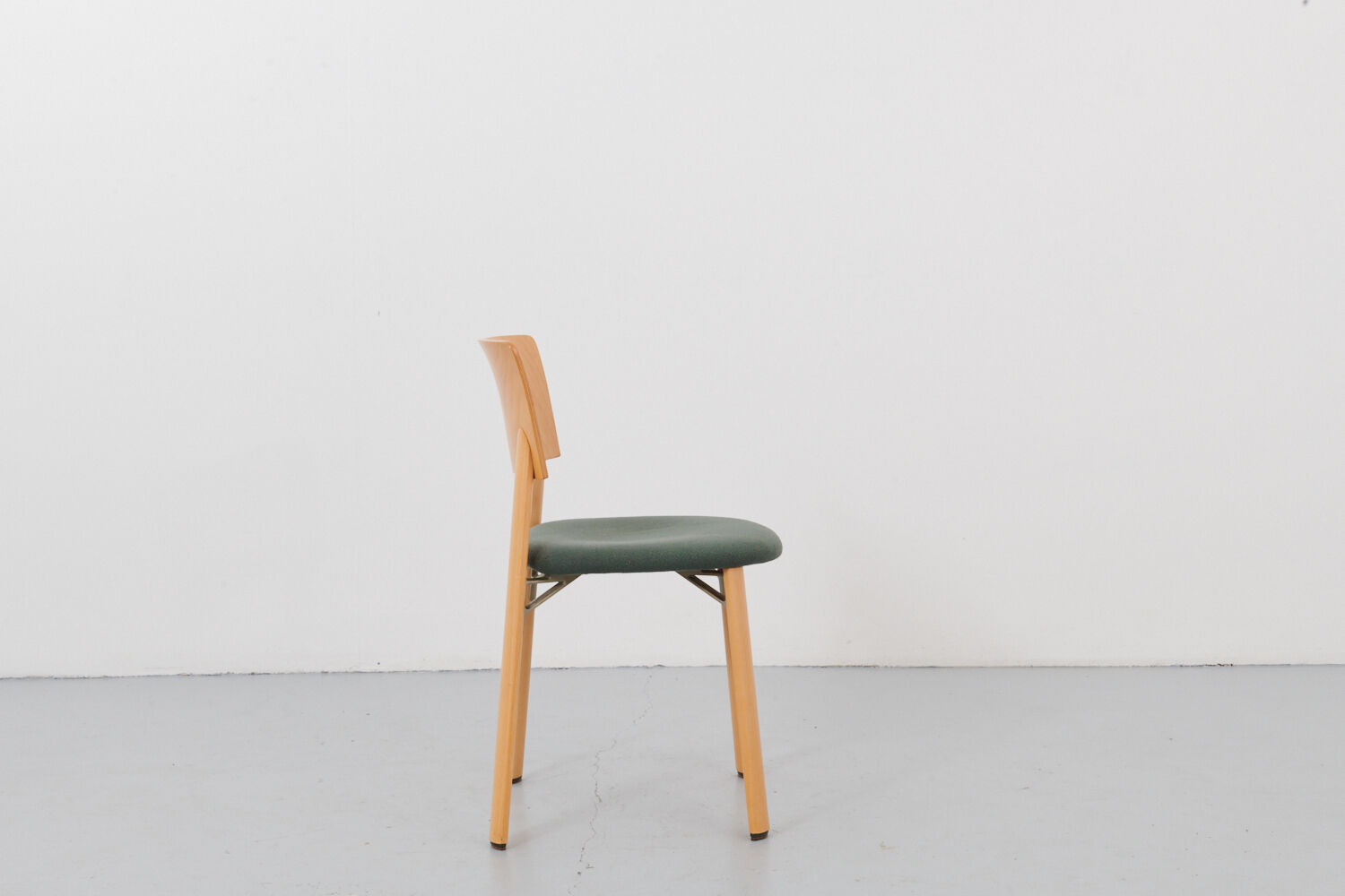 Kusch &Co chair made of wood and green fabric