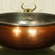 Copper cauldron with golden bronze bull heads