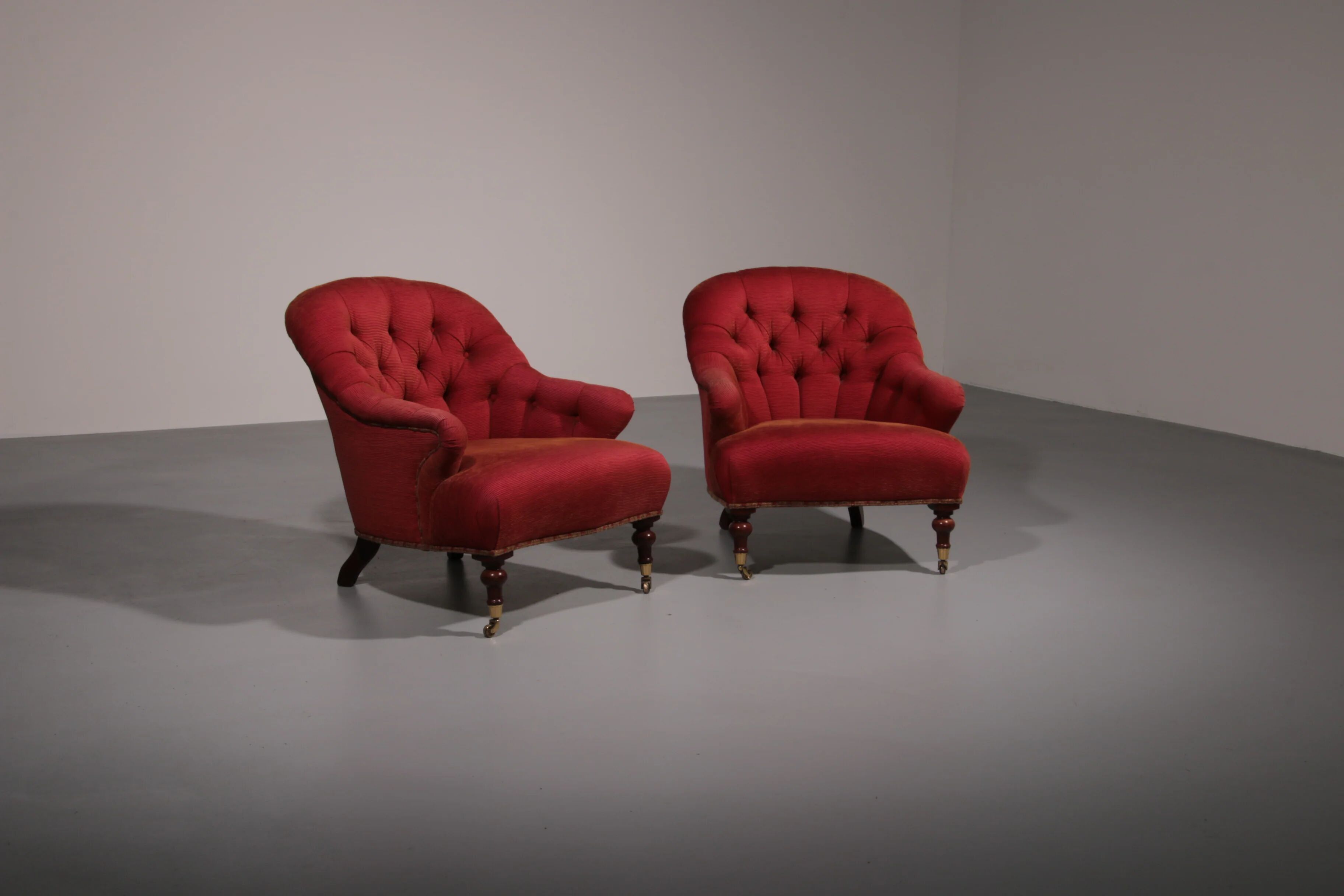 Pair of French red fabric button back armchairs