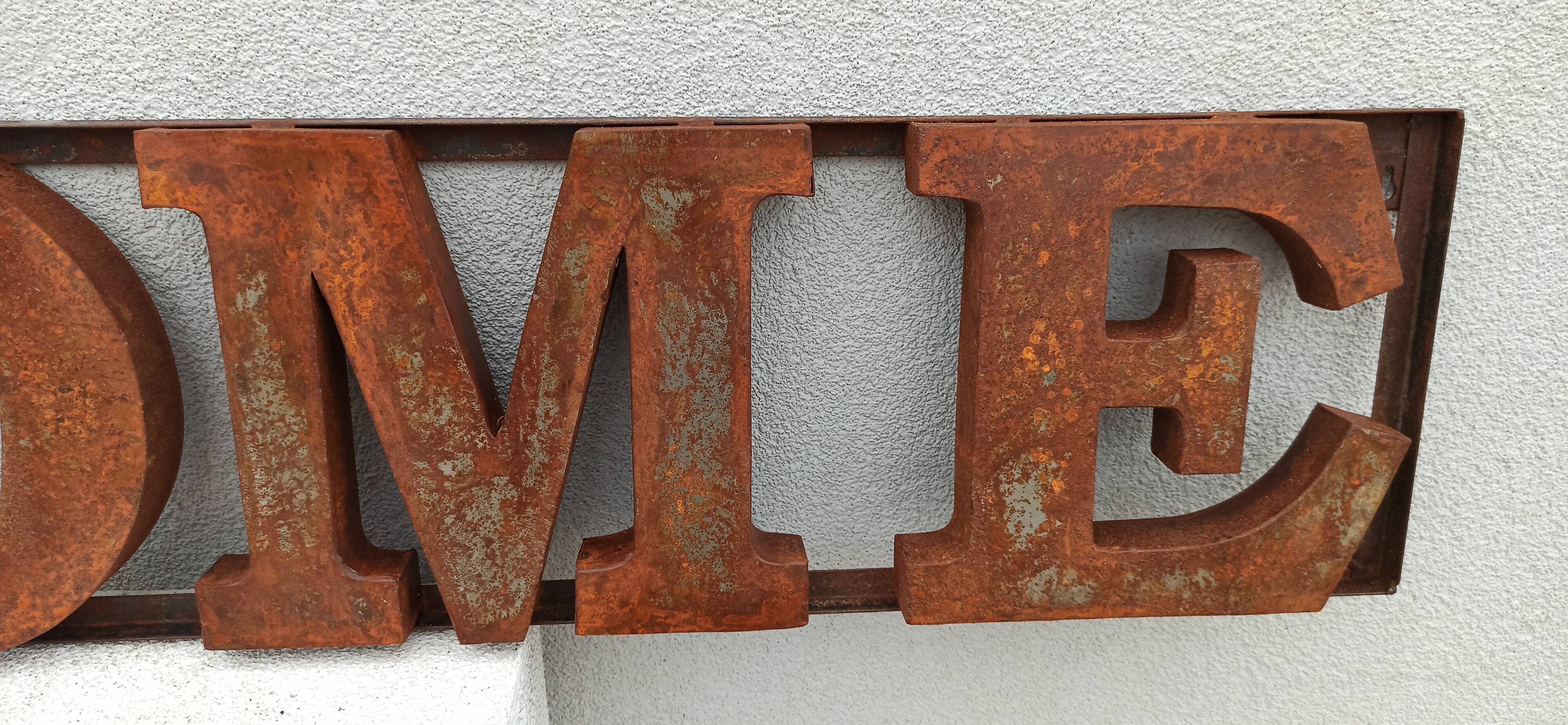 HOME rusty metal sign