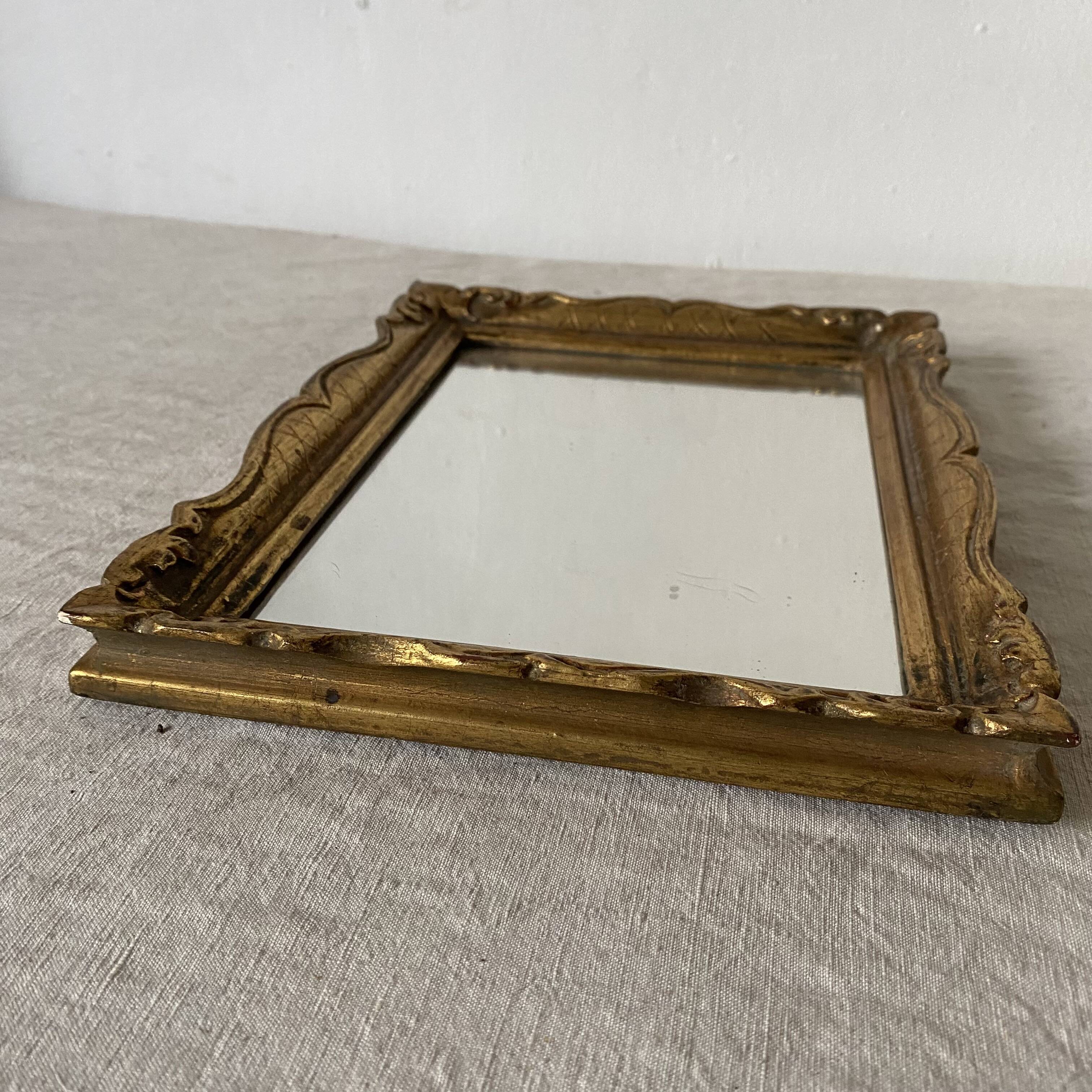 Small molded gilded mirror
