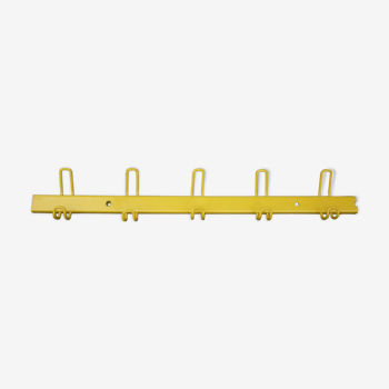 Yellow metal wall coat holder