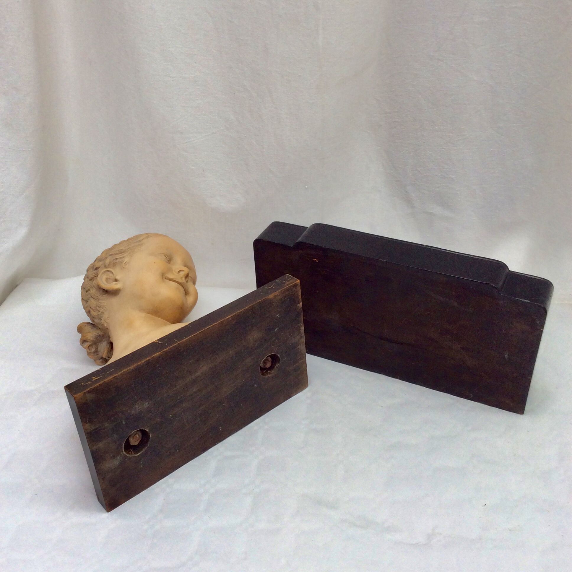 Girl's head in terracotta numbered