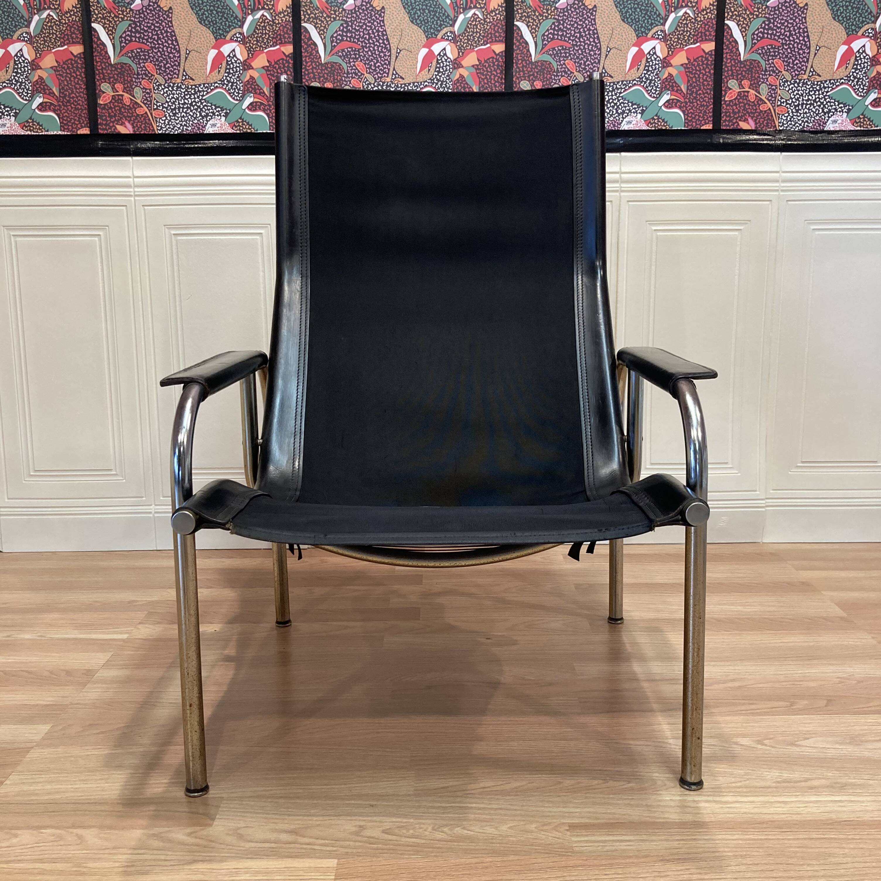 Reclining armchair in black leather and chrome design "hans eichenberger" 1960.
