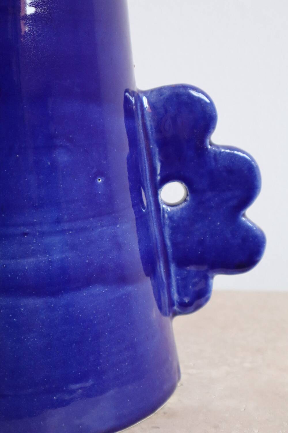 Handmade abstract ceramic vase with asymmetrical floral handles in midnight blue