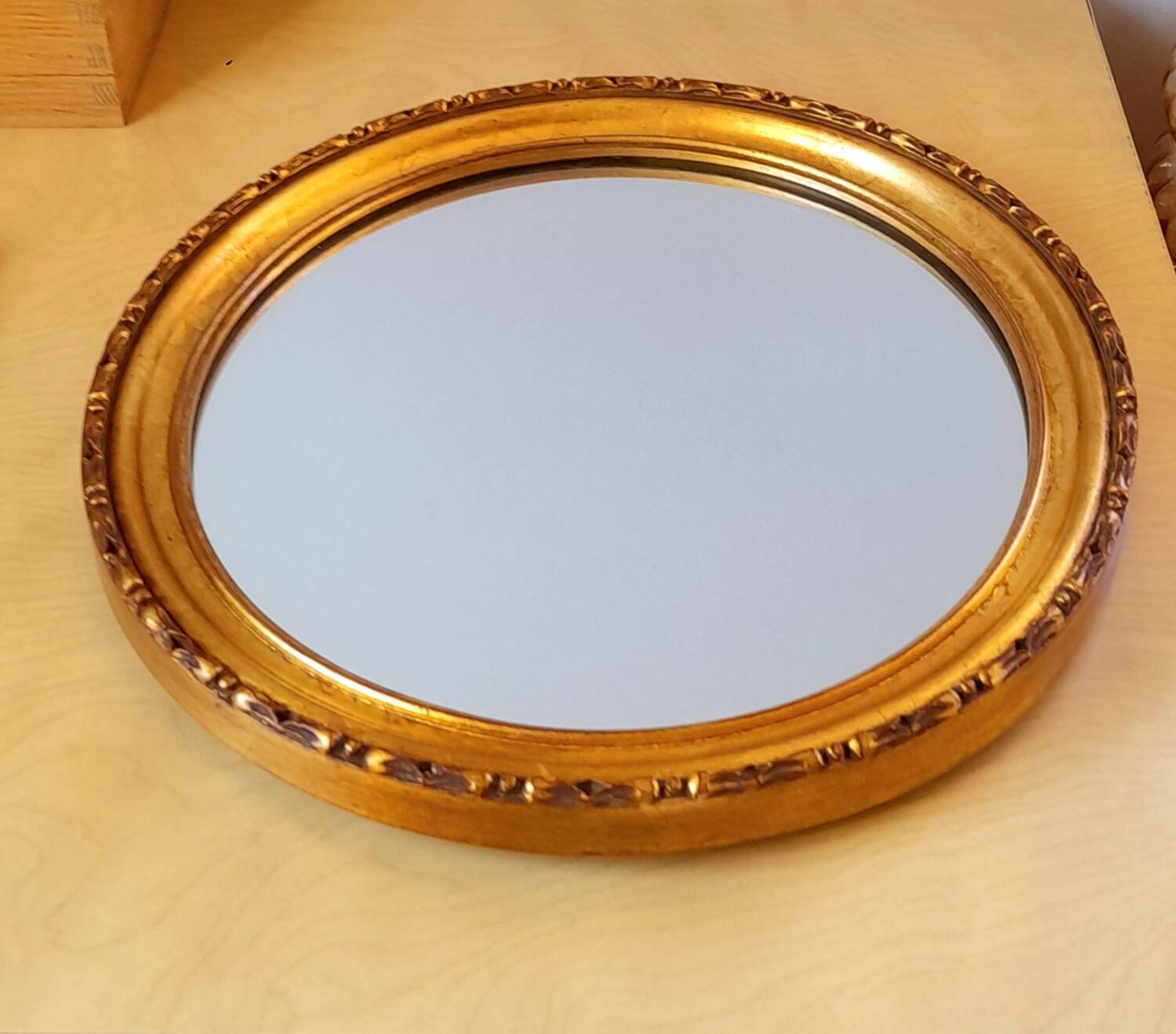 Round golden mirror