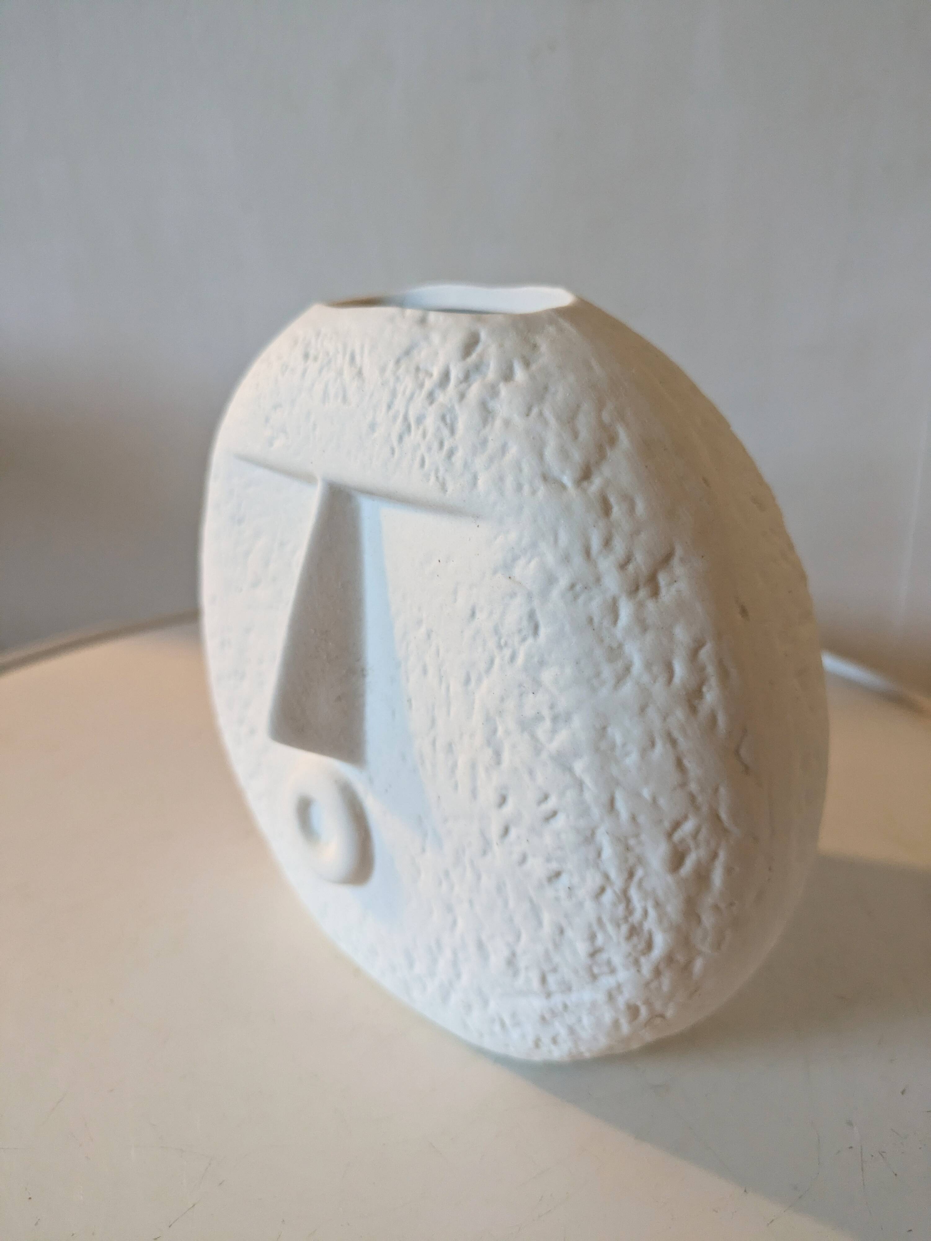 Stylized face biscuit vase